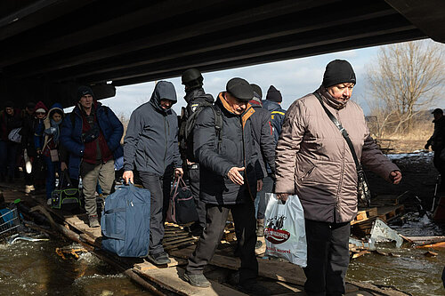 People fleeing Irpin, Ukraine in March 2022